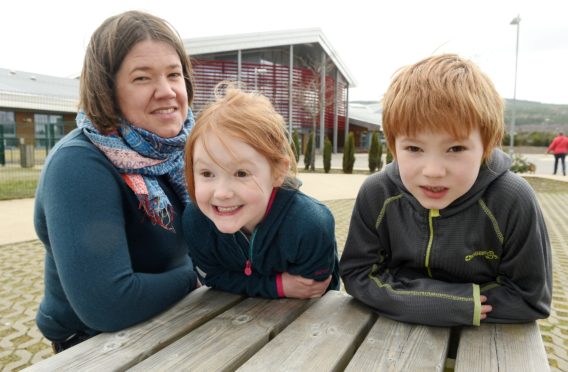 Carole Butler is concerned about the loss of additional support needs staff with her children, Megan and Struan.