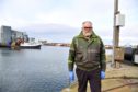 Mechanic Mark Reason is worried about the amount of oil slicks in Fraserburgh harbour.
