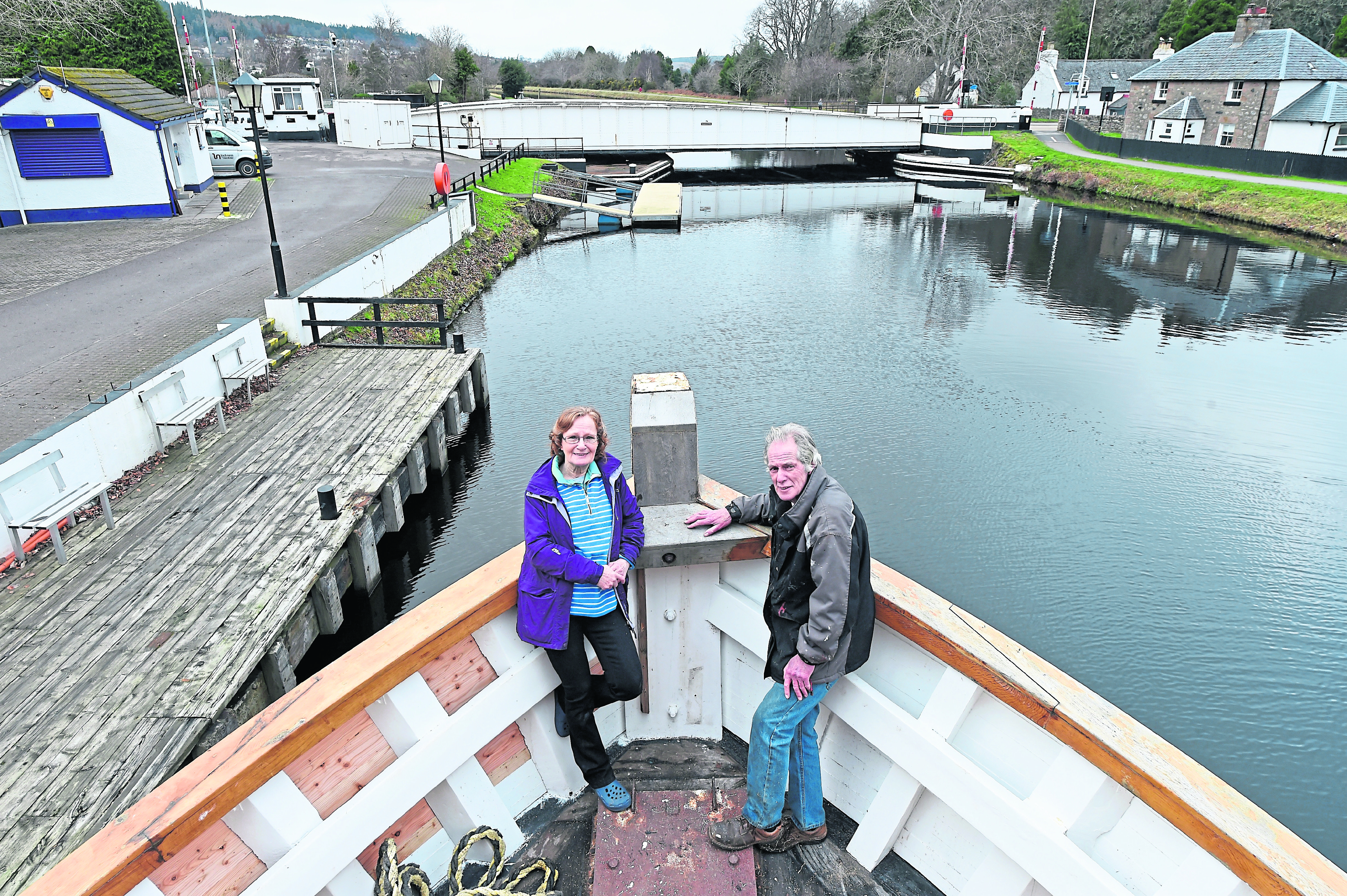 Gaby Monkhouse and her husband Gus Glue with their vessel 'Highland Lassie' on the Caledonian Canal.