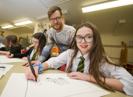 National Galleries of Scotland outreach officer Richie Cumming 
works with Milne's High School S1 pupil Anna Russell.
