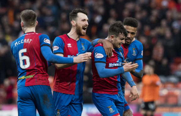 Aaron Doran is mobbed after scoring the winner against Dundee United.