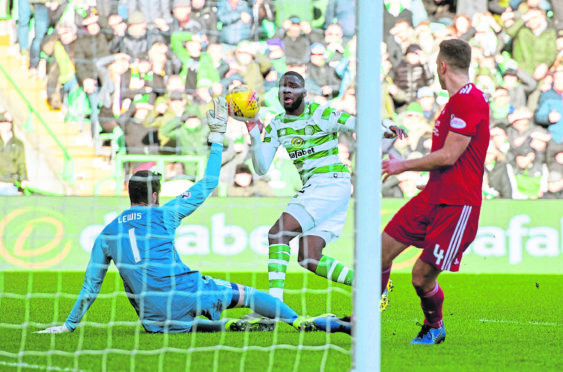 Joe Lewis saves from Odsonne Edouard in the second half at Celtic Park.
