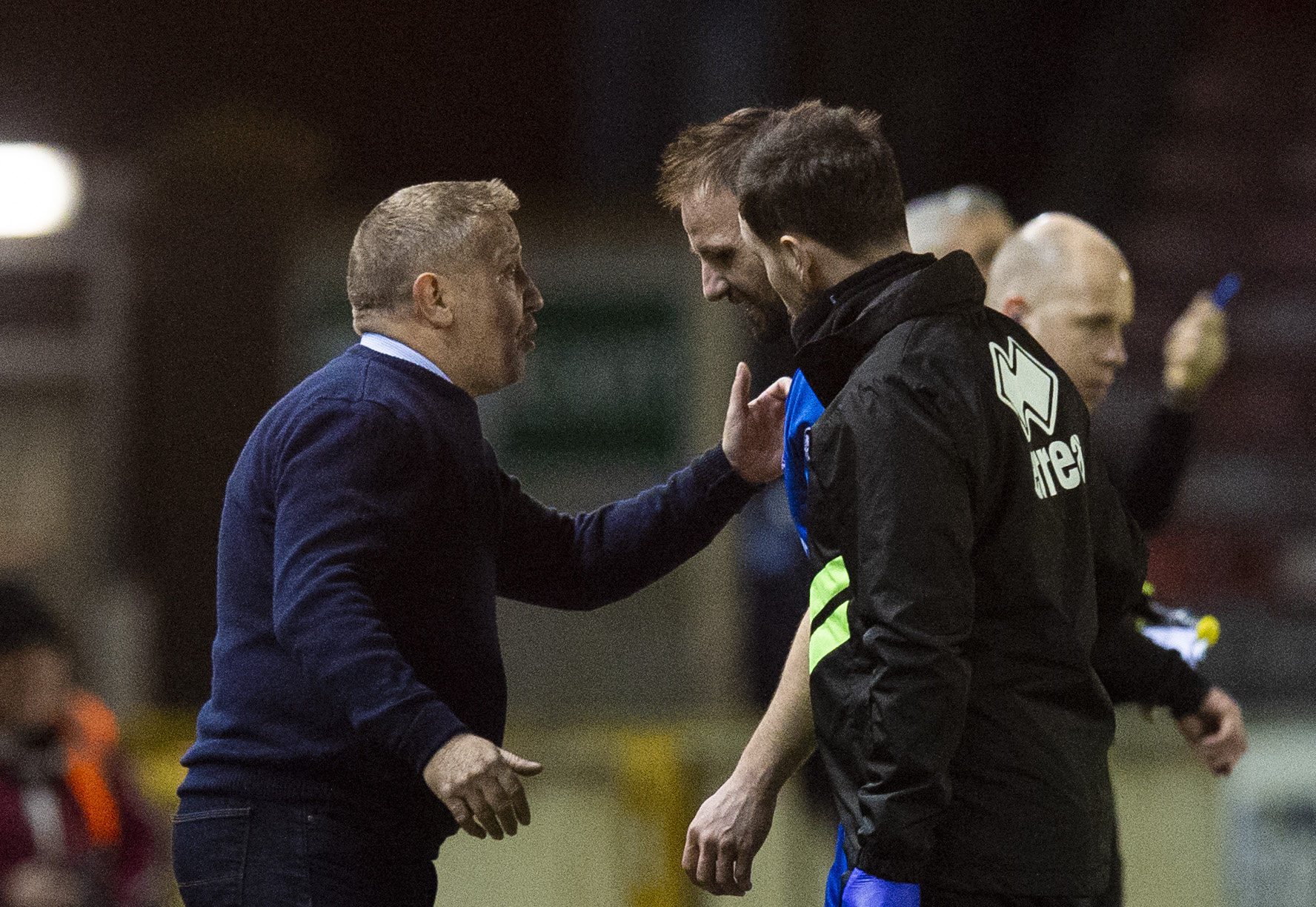 Inverness CT manager John Robertson (L) speaks with Sean Welsh as he leaves the field with an injury