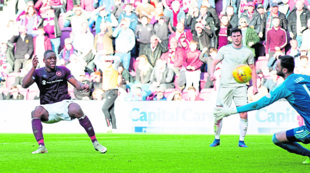 Hearts Uche Ikpeazu scores past Aberdeens Joe Lewis to make it 2-1.