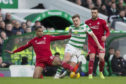 James Forrest is stopped by Aberdeen's Max Lowe.