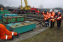 Volunteers carry out a test rotation of the turntable