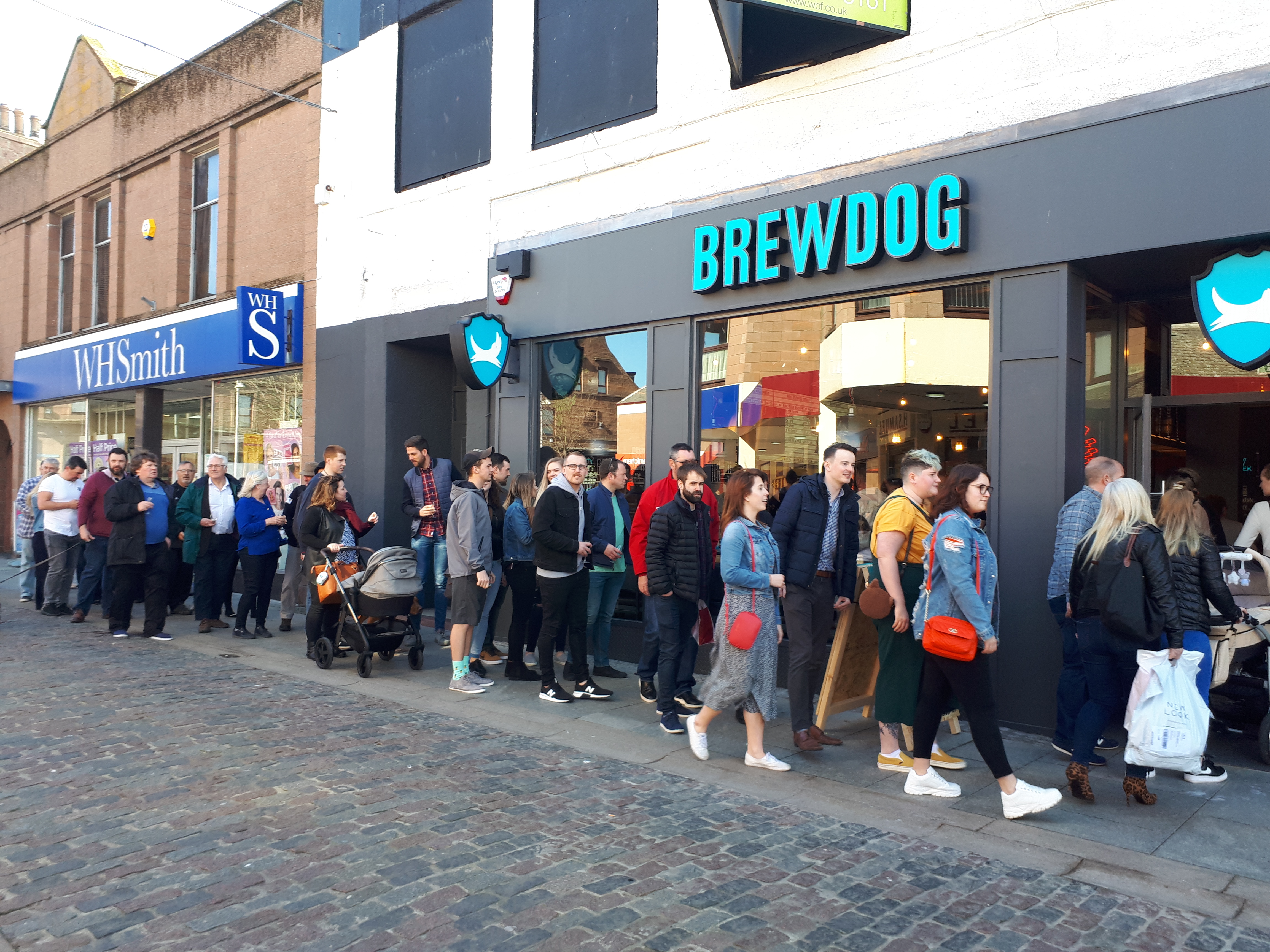 Eager locals and visitors queuing to be the first customers welcomed into BrewDog which is hoped will boost the town