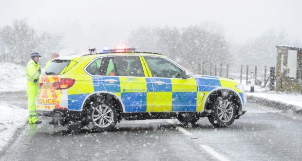 Police at the scene of the crash. Picture by Colin Rennie.