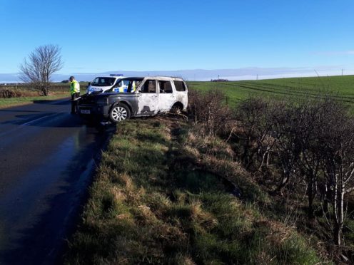 The burnt out car on the A981