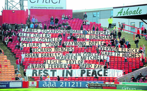 Tribute to the crew and passengers of the Super Puma crash before the game against Inverness Caley Thistle at Pittodrie.