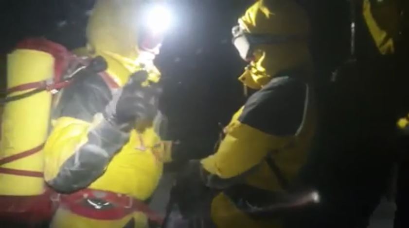 Screengrab from Cairngorm MRT's rescue video of a snowboarder and his dog.