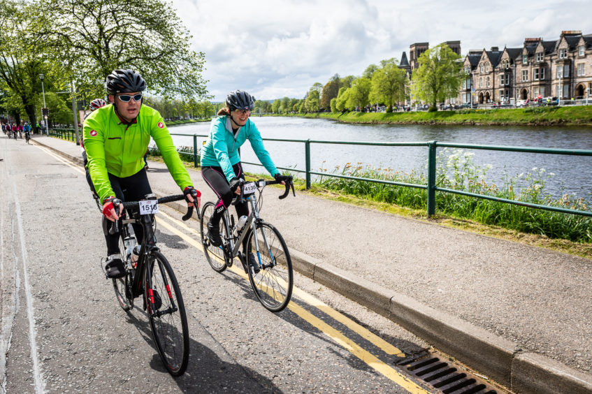 Enjoying the final moments as riders pass along the River Ness and into town.