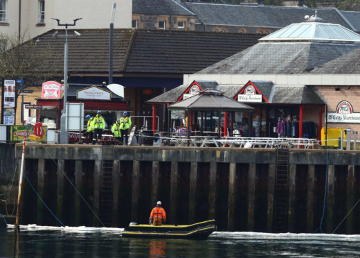 A cordon has been placed around a boat that has sunk in Oban Bay. photo Kevin McGlynn