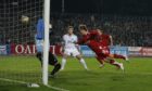 Darren Mackie heads in the decisive goal against Dnipro.