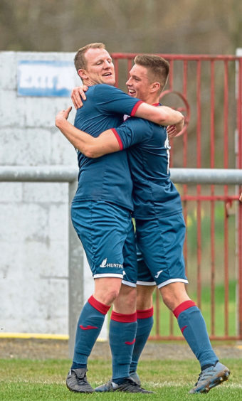 L 4 Turriff Ross Anderson gets a hug for opening the scoring.