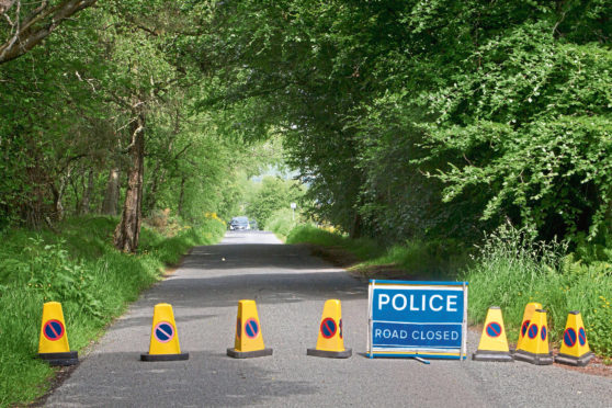 Kinnordy nature Reserve Murder.....police attend two locations....17 Hill Rise in Kirriemuir and Egnanoss Road behind Westmuir....various locations..

Pic shows police roadblock at Egnanoss Road behind Westmuir..pic :Paul Reid