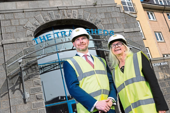 Gavin Currie, managing director of Bancon Construction (left), with Liz Hodge, chief executive of Aberdeen Science Centre (right), outside the old granite Tramsheds