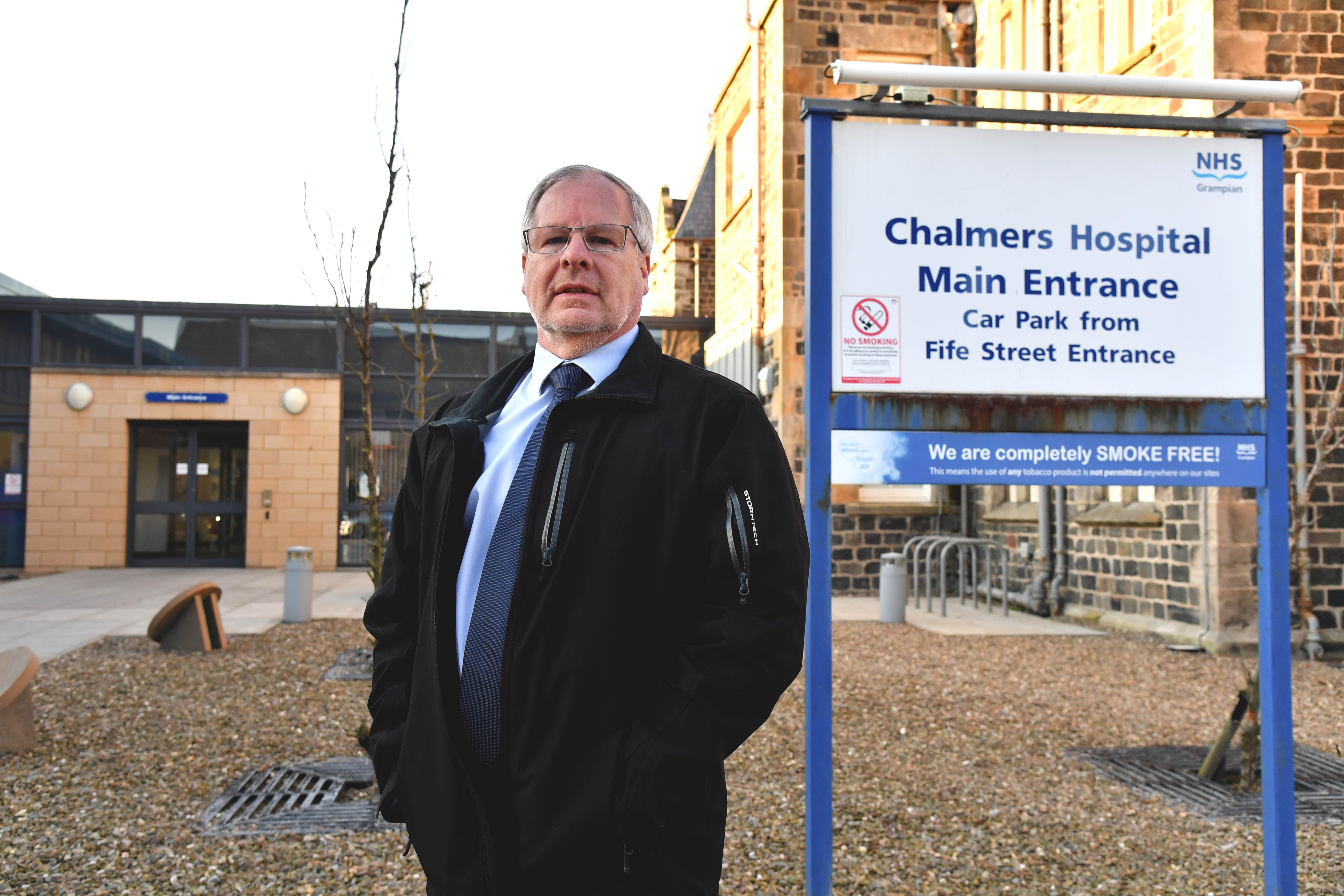 Councillor John Cox outside Chalmers Hospital in Banff