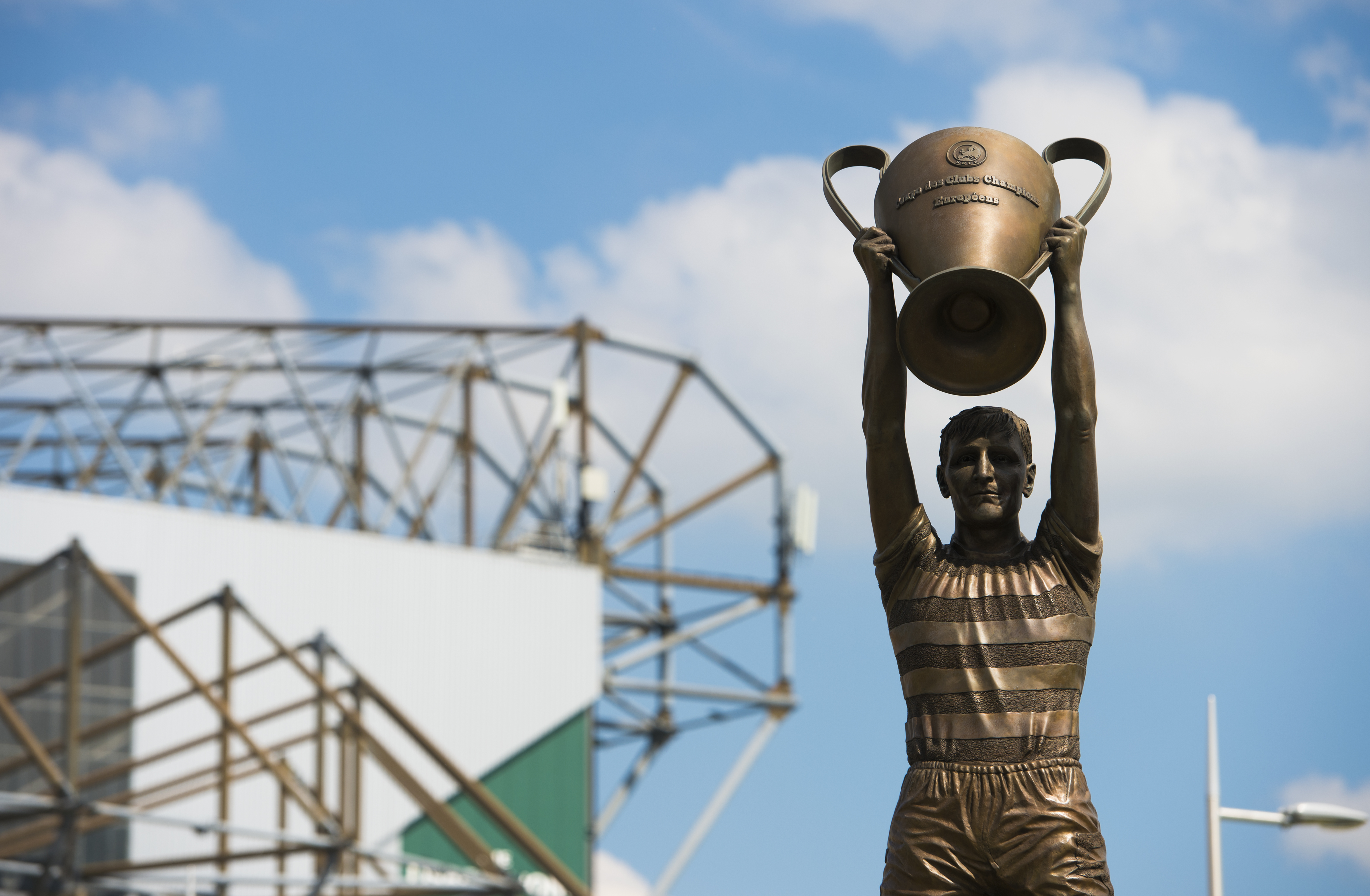 The statue of Billy McNeill holding the European Cup trophy at Celtic Park.