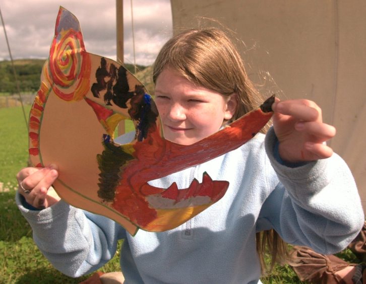 Samantha Falconer 8 from Sheddocksley with the mask she made at the Iron Age farm
picture by Amanda Gordon