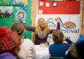 Author Mandy Elizabeth Rush reads her book Haggis history and facts to the young festival goers
