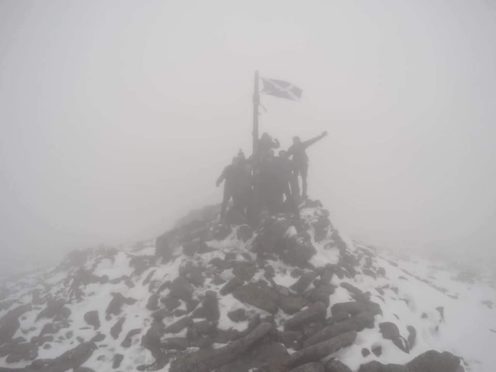 The team at the summit of Mount Keen on Sunday afternoon.