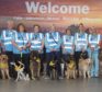 Easily identifiable in their high-vis jackets and bandanas, the dogs will mingle with passengers and staff throughout the terminal.