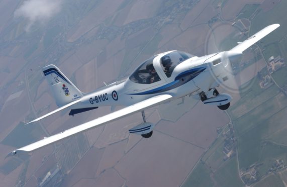 A Grob Tutor photographed over Lincolnshire, similar to the one to be used by the students.