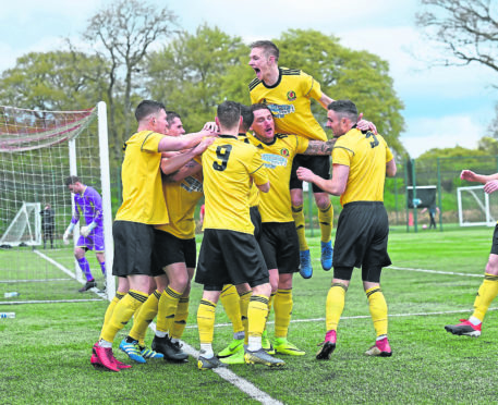 Cove celebrate their opening goal at East Kilbride.