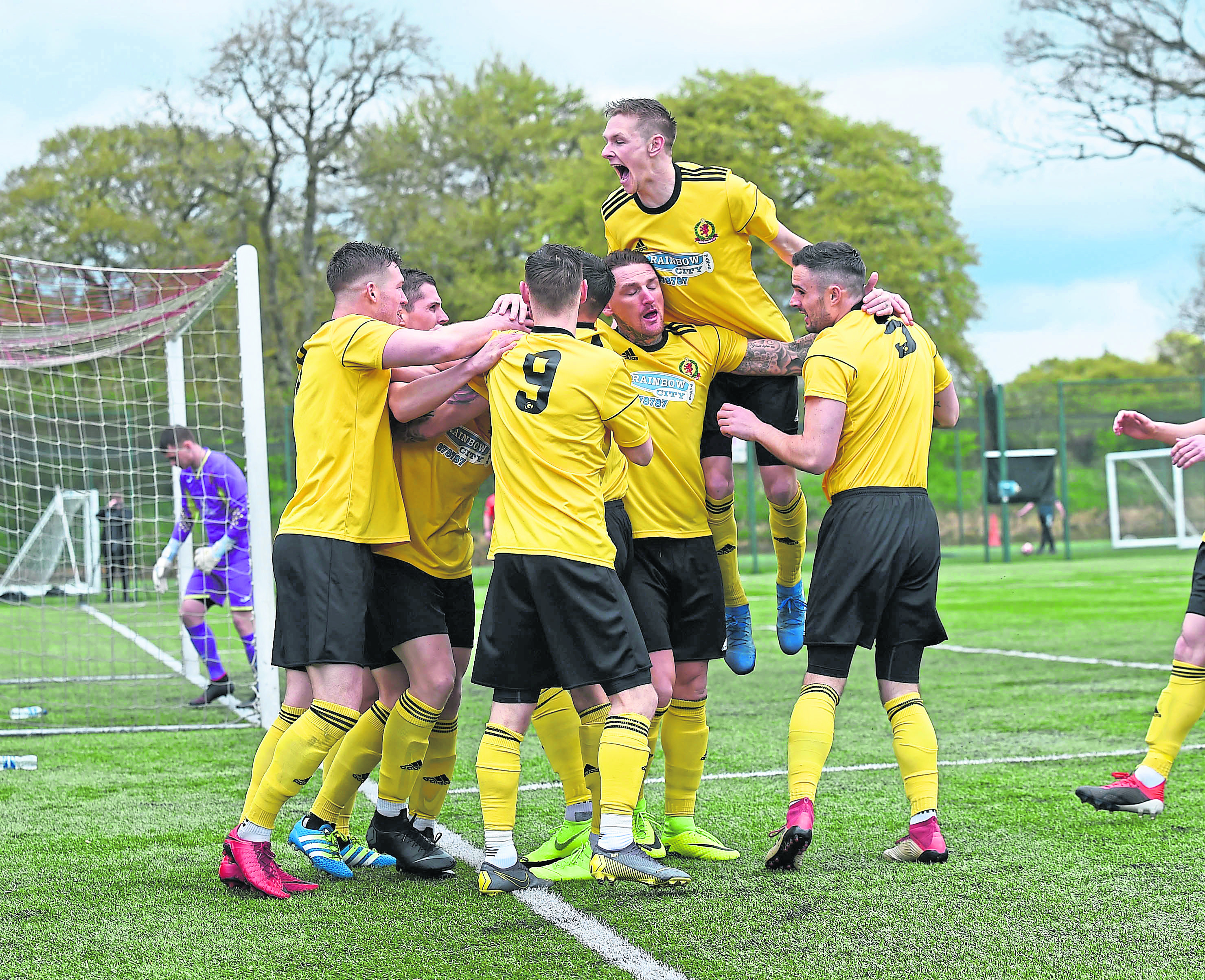 Cove celebrate their opening goal at East Kilbride.