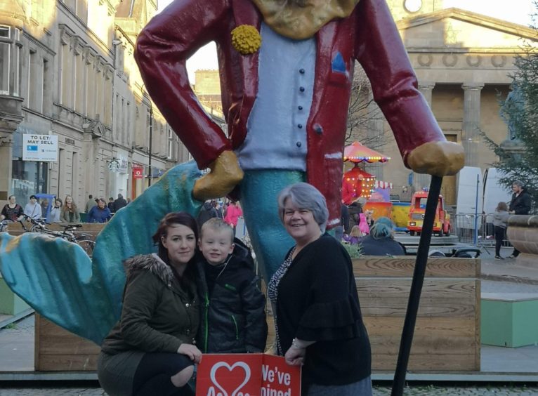 Lauren O'Shane, her son Jordan and BHF Scotland shop manager Jo Hewitt in Elgin