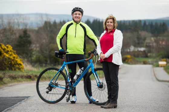 Moray MSP Richard Lochhead and Elgin Rotary Club member Julie Williams.