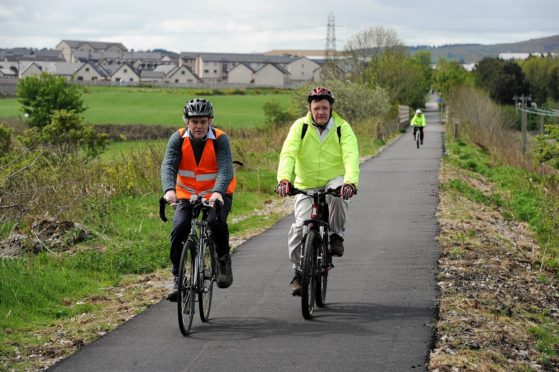 Councillors Martin Ford and Paul Johnston riding bikes on the Formartine and Buchan Way
