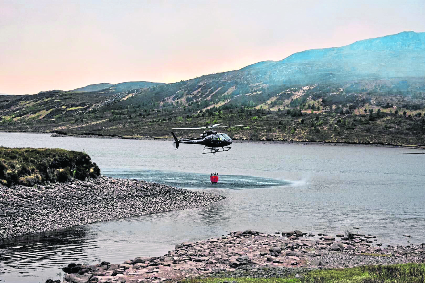 A helicopter was also drafted in to waterbomb the affected area