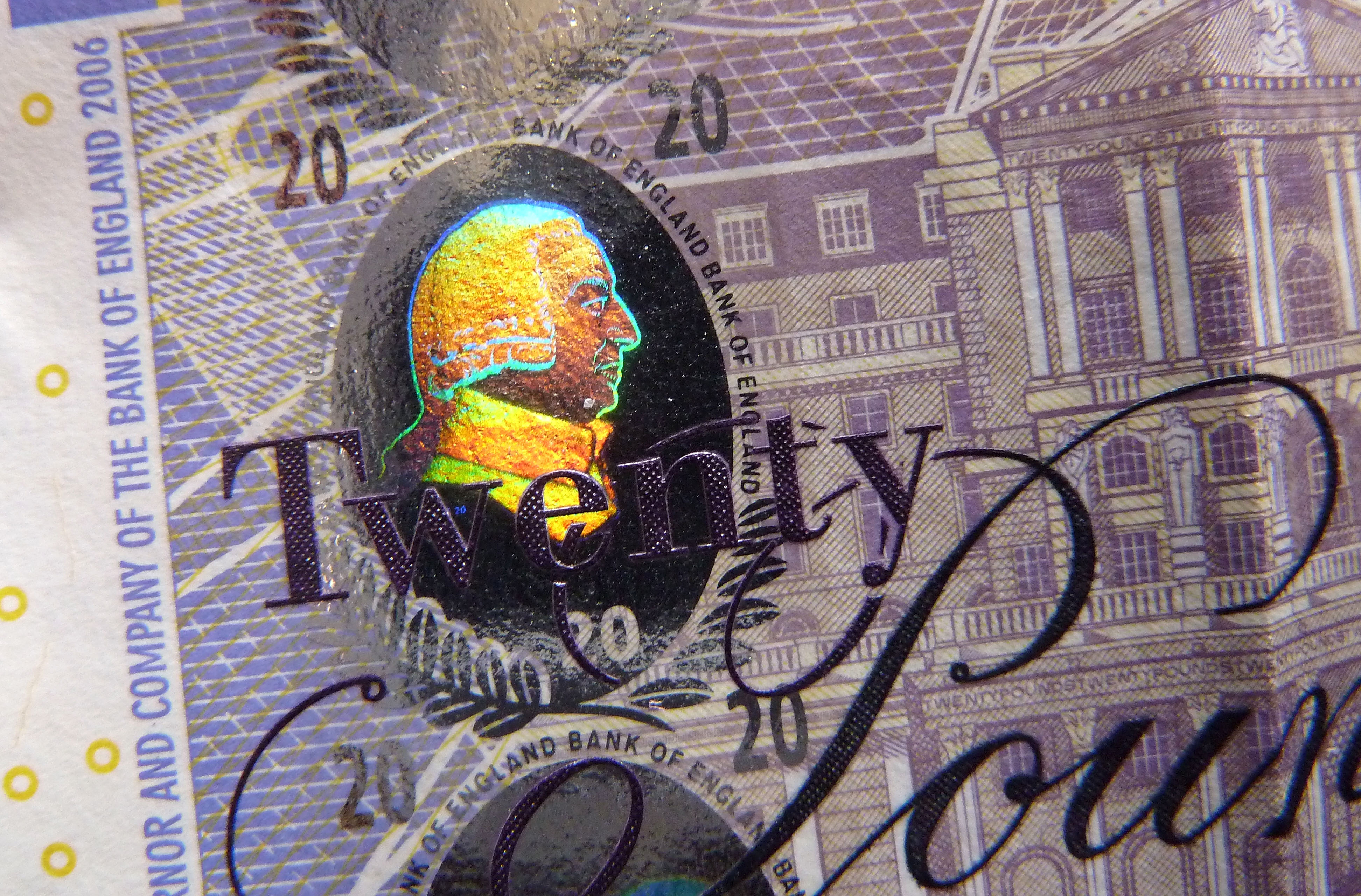 LONDON, ENGLAND - FEBRUARY 24:  A detail of the holographic foiling on a £20 banknote, featuring a profile of the economist Adam Smith, on February 24, 2016 in London, England. The next range of banknotes will be printed on polymer. The new £5 note will be issued in September 2016 and will feature Sir Winston Churchill, the £10 note will be issued in 2017 and the £20 note by 2020.  (Photo by Jim Dyson/Getty Images)