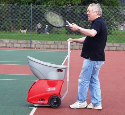 Hamish McBain received an award for his life-time work in tennis in Moray.