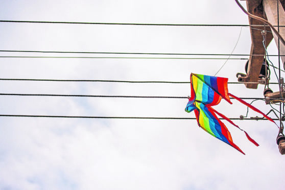 A kite stuck on a power line.