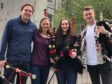Lathallan pupils Lydia Broadley and Rebecca Foster with two members of the Red Hot Chilli Pipers Band