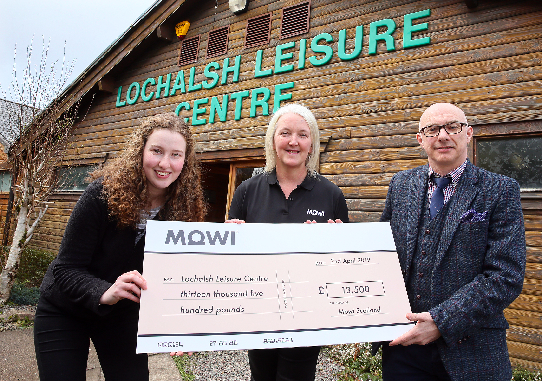 Kendal Hunter and Heather O’Neill of Mowi present half of the fundraising total to Paul Wood, chairman of the Lochalsh Leisure Centre