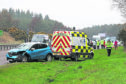 The scene of a 3-car accident on the A9 at the Munlochy junction, involving a white Audi Q2, blue Renault Captur, and dark grey Ford Fiesta.