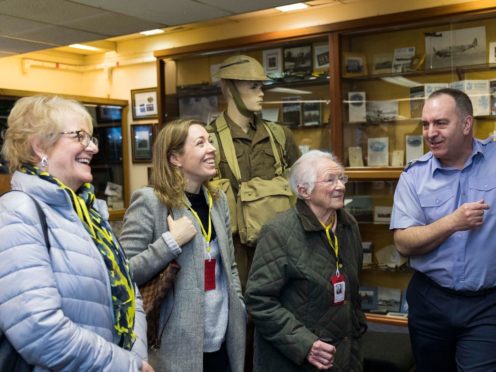 Ann Buchan, 94, visits the RAF Lossiemouth heritage centre with volunteer John Baxter and her daughter and granddaughter.