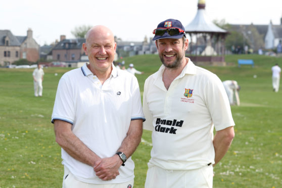 Dave Gibson, brother of Neil and Alan Gibson, with Dave Wolton vice-chair of Nairn County Cricket Club.