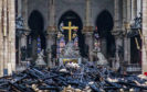 Debris are seen inside Notre Dame cathedral in Paris, Tuesday, April 16, 2019. Firefighters declared success Tuesday in a more than 12-hour battle to extinguish an inferno engulfing Paris' iconic Notre Dame cathedral that claimed its spire and roof, but spared its bell towers and the purported Crown of Christ. (Christophe Petit Tesson, Pool via AP)