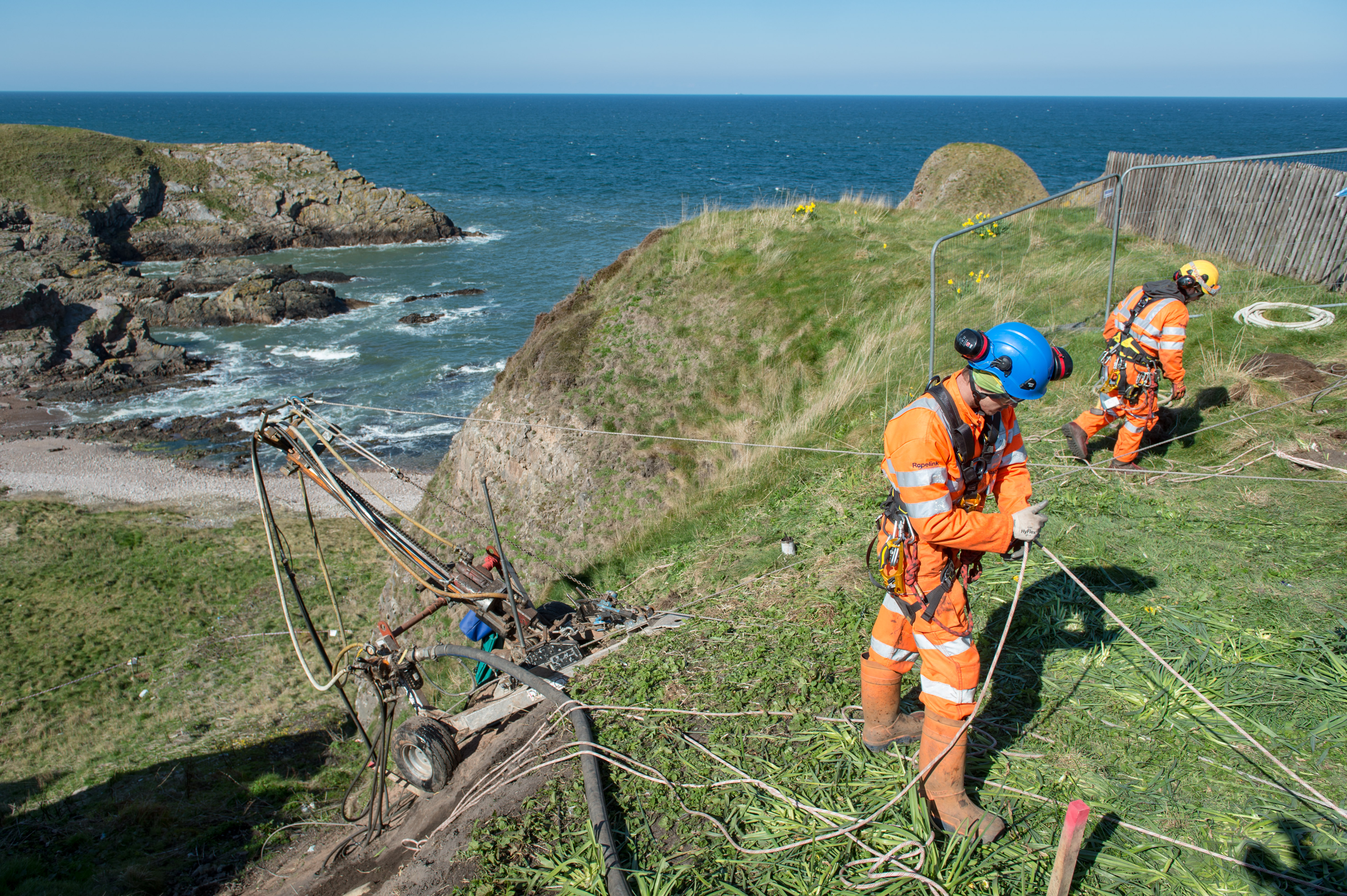 Work steps up at Portknockie Harbour to secure any future landslip.
Rope access drillers) Kyle Robinson (blue hat) and Josh Mundley (yellow hat).
Picture by Jason Hedges
