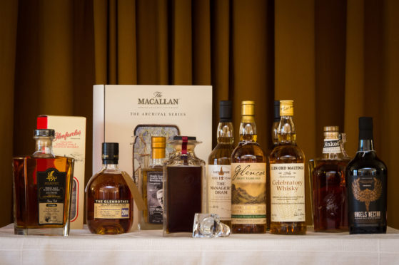 The final submissions for Craigellachie Village Council's annual whisky auction are being handed in.