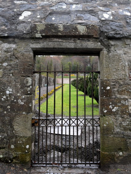 The gate in the wall dated 1715.