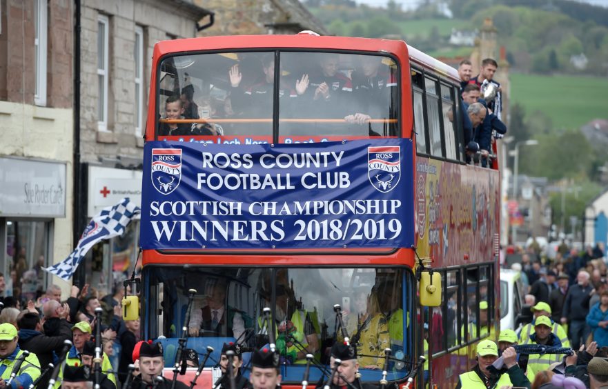 Ross County celebrated their winning of the Scottish Championship with a party in Victoria Park followed by an open top bus parade through Dingwall on Saturday afternoon to show off their silverware.    The trophy is paraded down Dingwall High Street lined with fans.