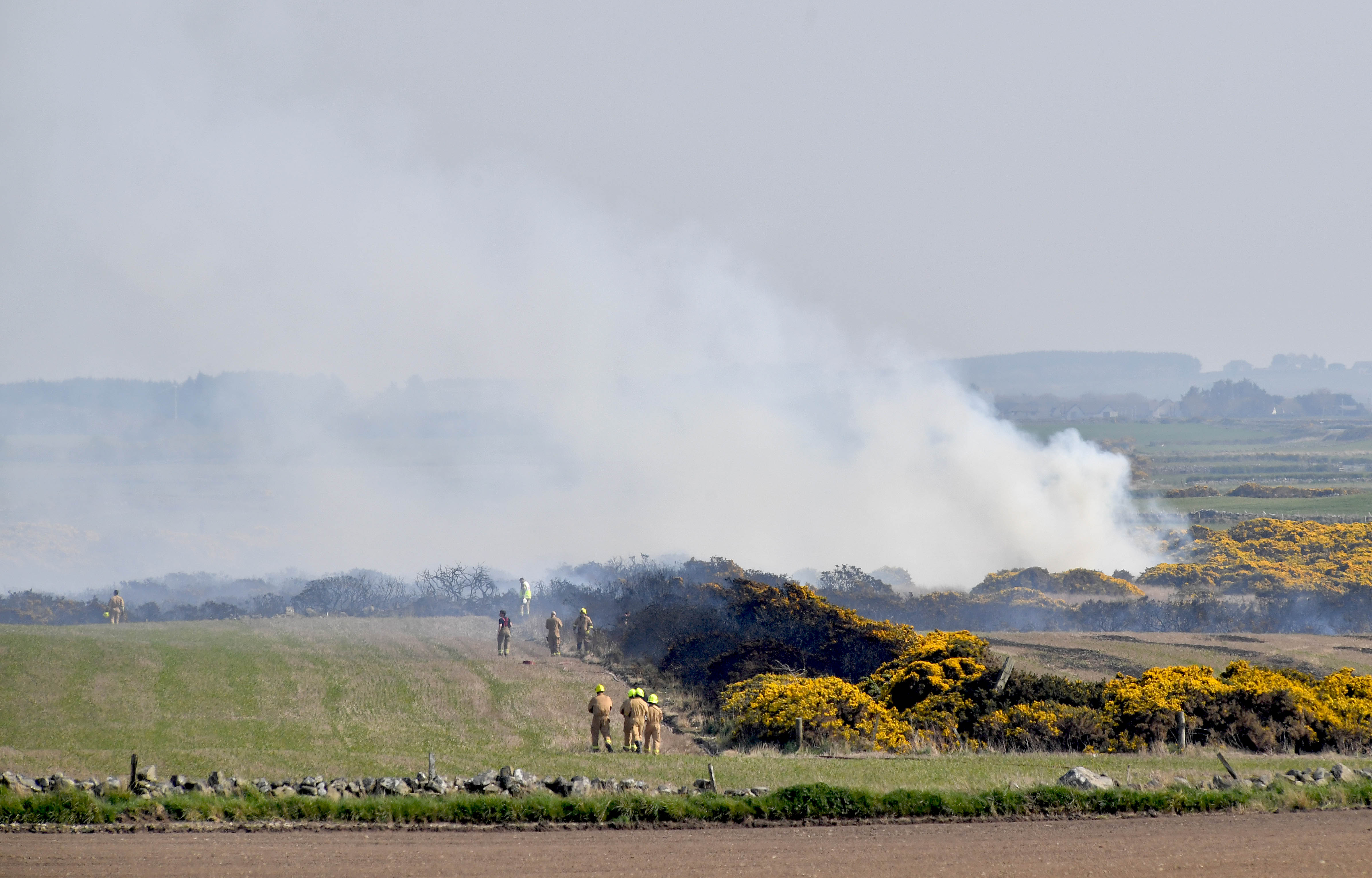 Fire services battle the gorse fire near Peathill.