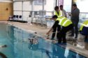 School students testing their ROV in the RGU Sport swimming pool