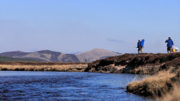 River Dee staff make their way to the project site on the River Muick